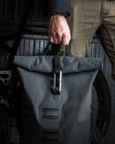 Replacing standard plastic clips with the VUUS Zero aluminum carabiner to upgrade backpack security and durability.